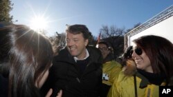 Former Italian Premier Matteo Renzi attends a demonstration staged by the Democratic party, in Como, Italy, Saturday, Dec. 9, 2017.