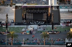 Debris litters the festival grounds across the street from the Mandalay Bay Resort and Casino, Oct. 3, 2017, in Las Vegas. Authorities said Stephen Craig Paddock, perched in the resort's hotel, used a cache of weapons to kill dozens and injure hundreds at a music festival at the grounds on Oct. 1.