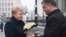Ukrainian President Petro Poroshenko, right, greets Lithuania's President Dalia Grybauskaite in Kyiv, Nov. 24, 2014.