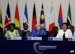 Britain's Prime Minister Theresa May chairs the first executive session of the CHOGM summit at Lancaster House in London, April 19, 2018.