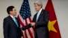 FILE - U.S. Secretary of State John Kerry, right, meets with Vietnam's Foreign Minister Pham Binh Minh during ASEAN meetings in Bandar Seri Begawan, Brunei on Tuesday, July 2, 2013. 