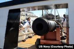 Sailors assigned to USS Constitution perform a War of 1812-era long gun drill in Charlestown Navy Yard, as part of Constitution's weekend festivities celebrating the U.S. Navy's 240th birthday, Oct. 10, 2015.