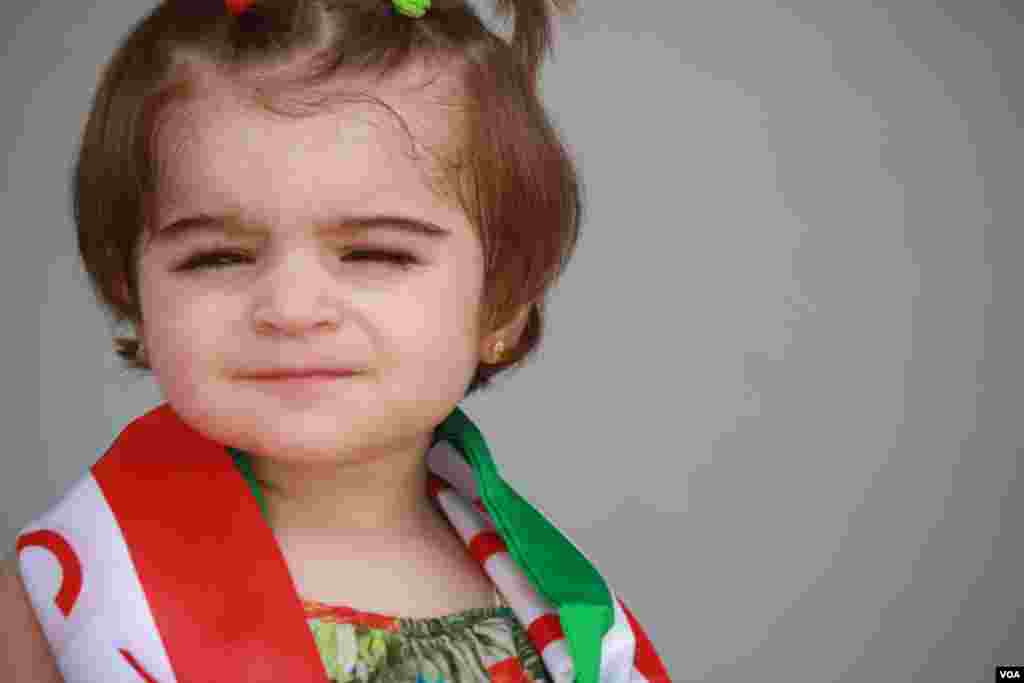 Despite threats the referendum will spark both domestic and international tensions, families in Irbil, where the Independence vote is wildly popular, adorn their children with Kurdish flags, celebrating the vote, Iraqi Kurdistan, Sept. 25, 2017. (H. Murdock)