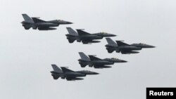 FILE - Taiwan Air Force's F-16 fighter jets fly during the annual Han Kuang military exercise at an army base in Hsinchu, northern Taiwan, July 4, 2015.