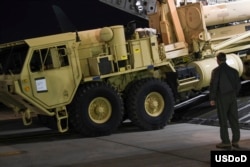 The first elements of a Terminal High Altitude Area Defense system (THAAD) to be installed in South Korea are unloaded from a U.S. military cargo plane, March 6, 2017.