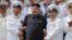 FILE- North Korean leader Kim Jong Un (C) poses with officers and sailors of Korean People's Army in this undated photo released by North Korea's Korean Central News Agency (KCNA) in Pyongyang June 16, 2014.