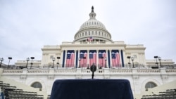 A lectern and microphone stand on a platform stage on the West Front of the U.S. Capitol building, where the presidential inauguration traditionally takes place, on Jan. 17, 2025, in Washington.