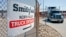 Trucks make their way around the Smithfield Foods packaging plant in Smithfield, Virginia, May 30, 2013.