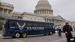 An Air Force bus waits on the Capitol plaza after President Donald Trump used his executive power to deny military aircraft to House Speaker Nancy Pelosi just before she was depart to visit troops abroad, on Capitol Hill in Washington, Jan. 17, 2019.