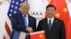 资料照片:美国总统特朗普与中国国家主席习近平在大阪召开的G20峰会上握手。(2019年6月29日)