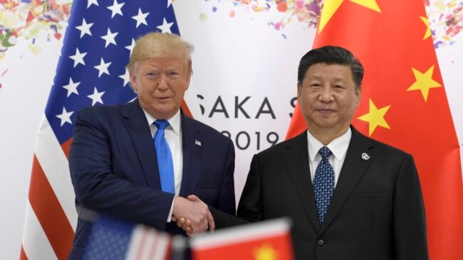 美国总统特朗普与中国国家主席习近平2019年6月在大阪召开的G20峰会上握手