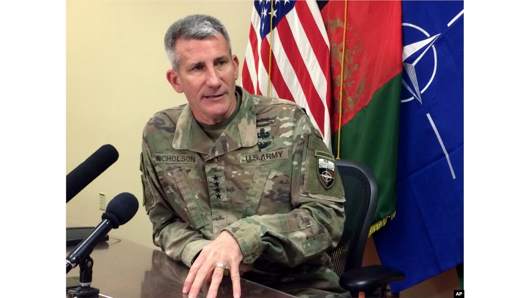 FILE - Gen. John Nicholson, the top American commander in Afghanistan, speaks to reporters, March 14, 2018, at Bagram air base north of Kabul, Afghanistan.