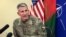 FILE - Gen. John Nicholson, the top American commander in Afghanistan, speaks to reporters at Bagram air base north of Kabul, Afghanistan, March 14, 2018.