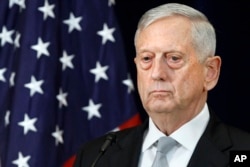 FILE - Defense Secretary James Mattis attends a news conference, Aug. 17, 2017, at the State Department in Washington.