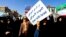 Pro-government demonstrators hold banners during a march in Iran's southwestern city of Ahvaz on Jan. 3, 2018, as tens of thousands gathered across Iran in a massive show of strength for the Islamic rulers after days of deadly unrest.