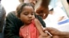 FILE - A Malagasy child receives a vaccination at a makeshift village clinic in Antanetikely, Madagascar.