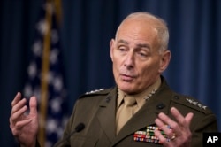 FILE - Gen. John Kelly speaks to reporters during a briefing at the Pentagon.