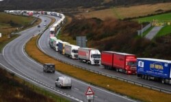 Trucks queue in Dover, England, Dec. 11, 2020. The U.K. left the EU on Jan. 31, but remains within the bloc's tariff-free single market and customs union until the end of the year.