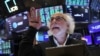 Traders work on the floor at the New York Stock Exchange on Aug. 8, 2024. The Dow Jones Industrial Average rose 1.8%.