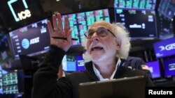 Traders work on the floor at the New York Stock Exchange on Aug. 8, 2024. The Dow Jones Industrial Average rose 1.8%.