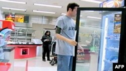 People photograph the countdown clock at Trafalgar Square in downtown London prior to the Opening Ceremony of the 2012 Summer Olympics, July 27, 2012, in London. 