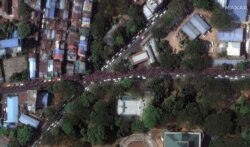 Maxar's satellite image shows crowds during protests along Kyun Taw Road near Myanmar Radio and TV Yangon in Yangon, Feb. 8, 2021. (Satellite image ©2021 Maxar Technologies/Handout)