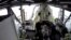 An opened hatch of the SpaceX Dragon capsule carrying NASA astronauts Robert Behnken and Douglas Hurley is seen as one of them exits it on a ship in the Gulf of Mexico, August 2, 2020, in this still image taken from a video. (NASA/Handout via Reuters)