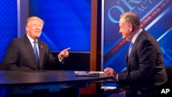 Republican presidential candidate Donald Trump, left, is interrviewed by Bill O'Reilly on Fox's news talk show "The O'Reilly Factor," Nov. 6, 2015, in New York.