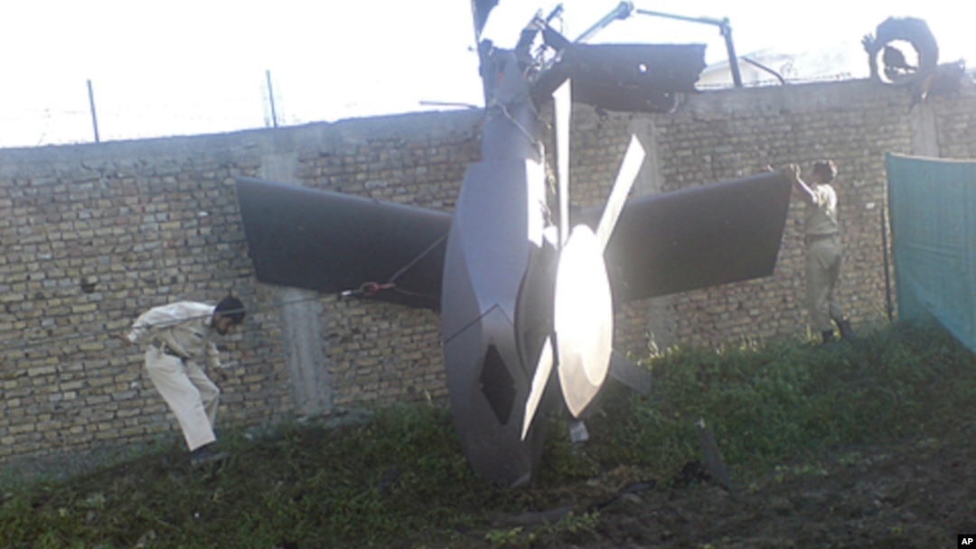 Part of a damaged helicopter is seen lying near the compound after U.S. Navy SEAL commandos killed al-Qaida leader Osama bin Laden in Abbottabad, Pakistan, May 2, 2011.