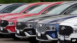 FILE - A line of 2022 Santa Fe SUV's sit outside a Hyundai dealership Sunday, Sept. 12, 2021, in Littleton, Colo. (AP Photo/David Zalubowski, File)