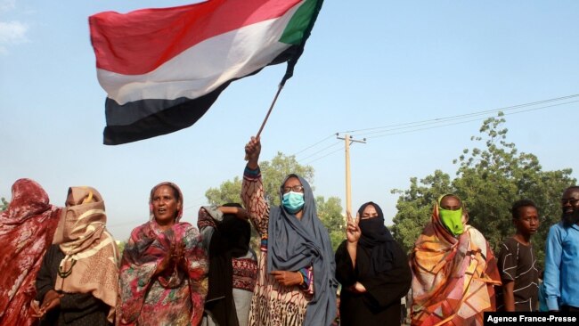 Sudanese protest against a military coup that overthrew the transition to civilian rule, on Oct. 25, 2021 in the al-Shajara district in southern Khartoum.