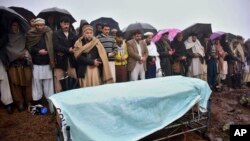 Villagers carry offer prayers at the funeral of a boy killed by Indian shelling, at a village in Hatian Bala, 40 kilometers from Muzafarabad, capital of Pakistani-controlled Kashmir, March 2, 2019.