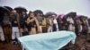 Villagers carry offer prayers at the funeral of a boy killed by Indian shelling, at a village in Hatian Bala, 40 kilometers from Muzafarabad, capital of Pakistani-controlled Kashmir, March 2, 2019.