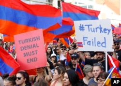 Huge crowds of Armenian Americans march during an annual commemoration of the deaths of 1.5 million Armenians under the Ottoman Empire in Los Angeles, April 24, 2019.