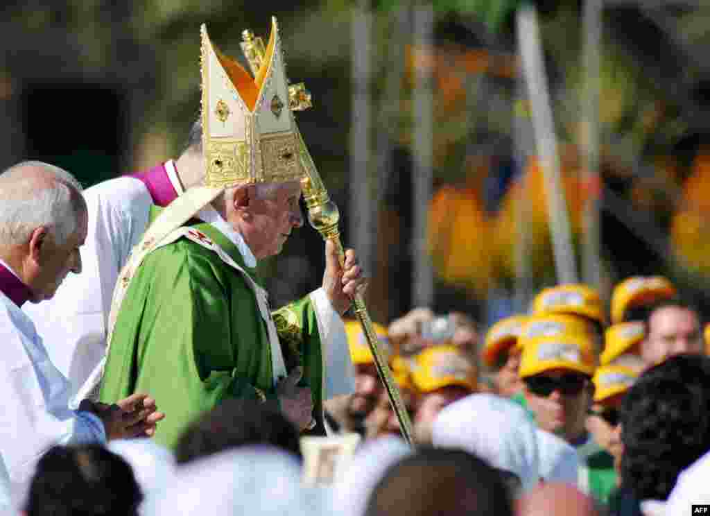 Pope Benedict XVI arrives to celebrate an open-air mass at Palermo, in the island of Sicily, Sunday, Oct. 3, 2010. Pope Benedict XVI paid tribute Sunday to a Palermo priest slain by the Mafia and encouraged Sicilians not to resign themselves to deep-roote