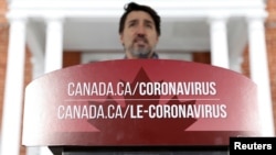 Le Premier ministre canadien Justin Trudeau à une conférence de presse alors que les efforts se poursuivent pour ralentir la propagation du coronavirus, Ottawa, Ontario, 23 mars 2020. (Photo Reuters/Blair Gable)
