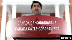 Le Premier ministre canadien Justin Trudeau à une conférence de presse alors que les efforts se poursuivent pour ralentir la propagation du coronavirus, Ottawa, Ontario, 23 mars 2020. (Photo Reuters/Blair Gable)