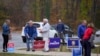 People arrive at polling place to vote, Nov. 5, 2024, in Springfield, Pa.