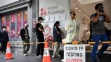 FILE - People queue at a walk-in coronavirus disease testing site in Melbourne, Australia Jan. 5, 2022. 