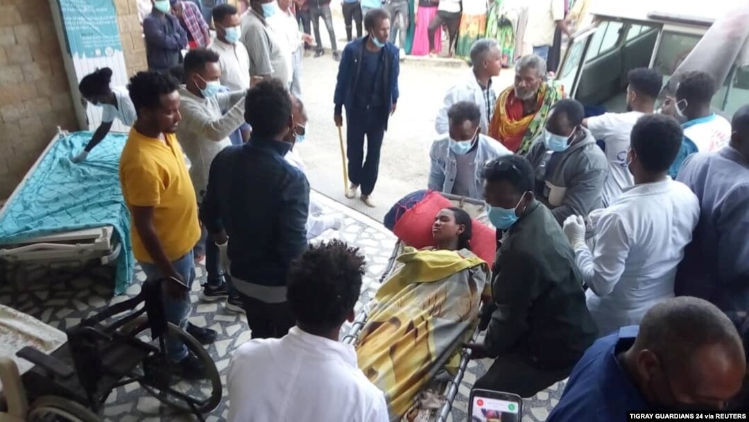 FILE - A woman is taken to Ayder Referral Hospital, in Mekelle, after an airstrike in Togoga, Ethiopia's Tigray region, June 22, 2021.