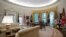 FILE - The newly refreshed Oval Office of the White House is seen in Washington, Aug. 22, 2017, during a media tour. New wallpaper was hung and the floors were refinished this month as part of a series of updates to the West Wing.