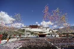 FILE - Balloons are released during the celebration event at the Potala Palace marking the 50th anniversary of the founding of the Tibet Autonomous Region, in Lhasa, Tibet Autonomous Region, China, Sept. 8, 2015.