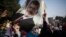 An Egyptian woman holds a portrait of ousted Egyptian President Mohamed Morsi during a protest in Nasr City in Cairo, Nov. 1, 2013.