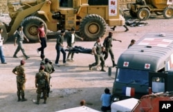 FILE - The scene at the U.S. Marine base near Beirut airport, Lebanon, following a suicide truck blast that destroyed the base and caused a huge death toll, Oct. 23, 1983.