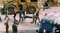 FILE - The scene at the U.S. Marine base near Beirut airport, Lebanon, following a suicide truck blast that destroyed the base and caused a huge death toll, Oct. 23, 1983. 