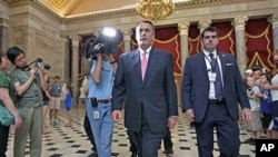 House Speaker John Boehner, who with house representatives must move quickly on an agreement to avert a potentially devastating default on US obligations, walks on Capitol Hill in Washington, August. 1, 2011
