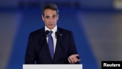 FILE - Greek Prime Minister Kyriakos Mitsotakis delivers a statement during the 8th MED7 Mediterranean countries summit, in Athens, Sept. 17, 2021.