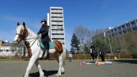 Manuela Jimenez, 15, rides Splash in a riding lesson at Ebony Horse Club in Brixton, London, April 18, 2021. (AP Photo/Kirsty Wigglesworth)