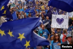 Pro-Europe demonstrators protest during a "March for Europe" against the Brexit vote result earlier in the year, in London, Sept. 3, 2016.