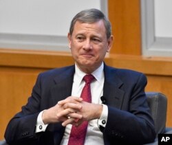 Chief Justice John Roberts prepares to speak at the The John G. Heyburn II Initiative and University of Kentucky College of Law's judicial conference and speaker series in Lexington, Ky., Feb. 1, 2017. During the 2016 presidential campaign, Donald Trump called the chief justice "an absolute disaster" and "disgraceful," mainly for the two opinions Roberts wrote that preserved President Barack Obama's health care overhaul.